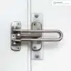 Stainless Swing Bar Latch Installation_result Stainless swing bar latch installed on a reinforced white door